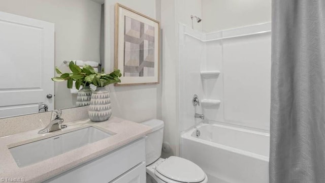 bathroom featuring toilet, vanity, and shower / bath combo with shower curtain