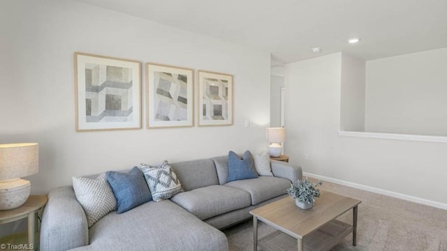 living area with carpet and baseboards