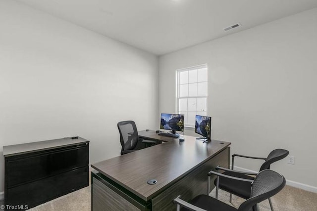 office space with visible vents, carpet floors, and baseboards