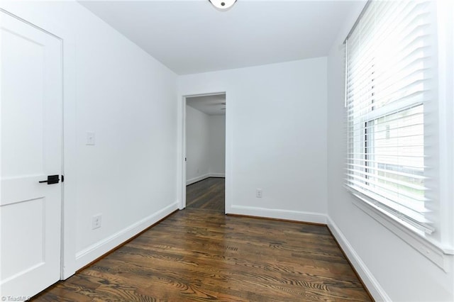 unfurnished bedroom featuring dark hardwood / wood-style flooring