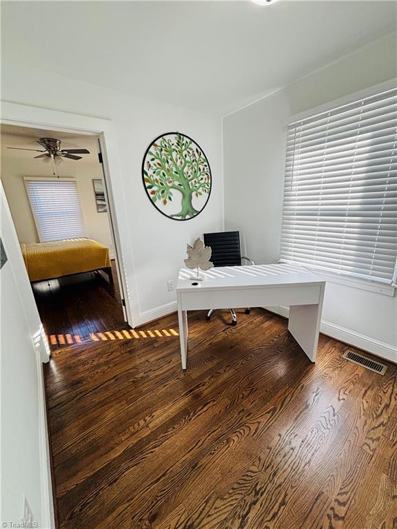 office featuring hardwood / wood-style flooring and ceiling fan