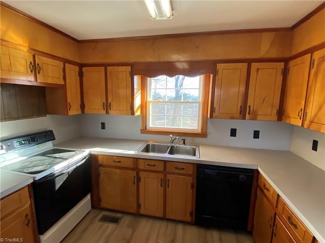 kitchen with sink, range with electric stovetop, dishwasher, and light wood-type flooring