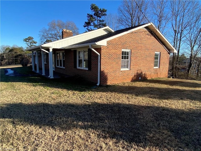 view of property exterior featuring a lawn