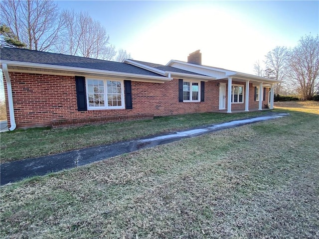 ranch-style home with a front yard