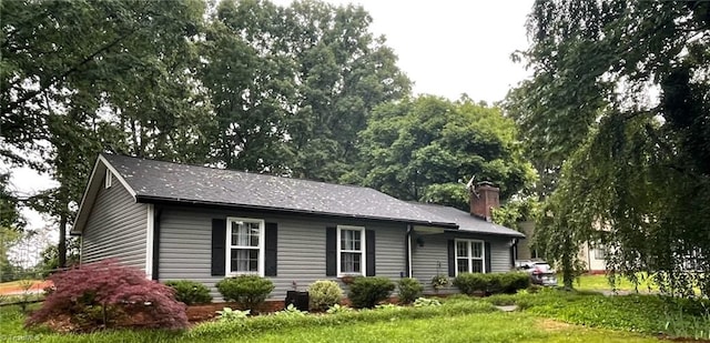 401 Turkey Hill Dr, King, NC 27021 - view of front facade with a chimney and a front lawn