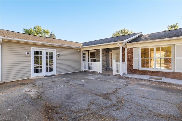 3227 Loftyview Dr, High Point, NC 27260 - exterior space featuring a porch and brick siding