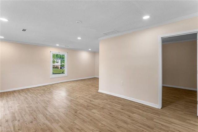 3227 Loftyview Dr, High Point, NC 27260 - unfurnished room with crown molding, visible vents, light wood-style floors, baseboards, and recessed lighting
