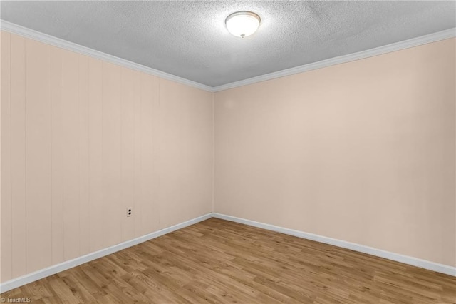 3227 Loftyview Dr, High Point, NC 27260 - spare room featuring a textured ceiling, ornamental molding, and wood finished floors