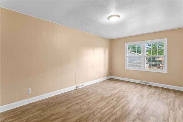 3227 Loftyview Dr, High Point, NC 27260 - empty room with visible vents, baseboards, and wood finished floors