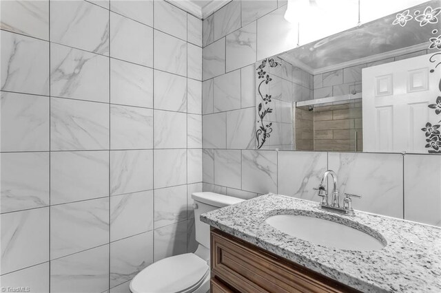 3227 Loftyview Dr, High Point, NC 27260 - bathroom with backsplash, toilet, tile walls, and vanity