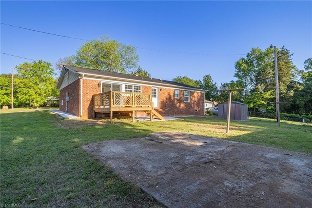 3227 Loftyview Dr, High Point, NC 27260 - rear view of property with a yard, a deck, and brick siding