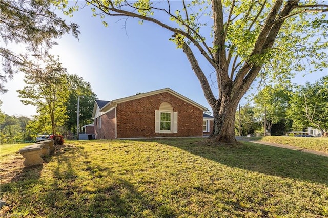 3227 Loftyview Dr, High Point, NC 27260 - view of property exterior with a yard and brick siding