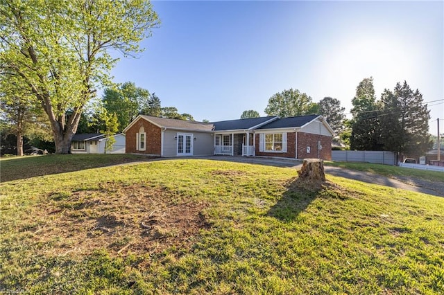 3227 Loftyview Dr, High Point, NC 27260 - ranch-style house featuring brick siding, fence, french doors, and a front lawn