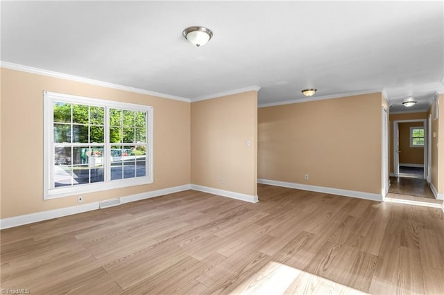 3227 Loftyview Dr, High Point, NC 27260 - unfurnished room featuring visible vents, ornamental molding, a wealth of natural light, and light wood-style floors