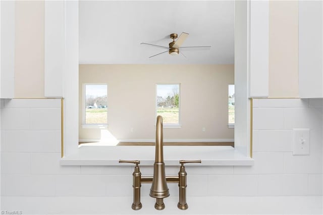 room details with a ceiling fan and backsplash