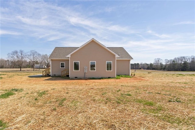 view of property exterior featuring crawl space and a lawn