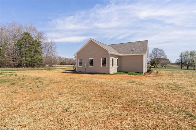 view of home's exterior featuring a yard and crawl space