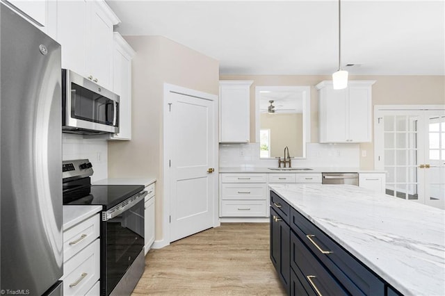 kitchen featuring a sink, white cabinetry, and stainless steel appliances