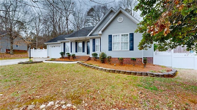 ranch-style house featuring a front yard, an attached garage, driveway, and fence