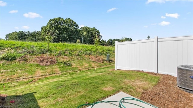 view of yard with central AC unit