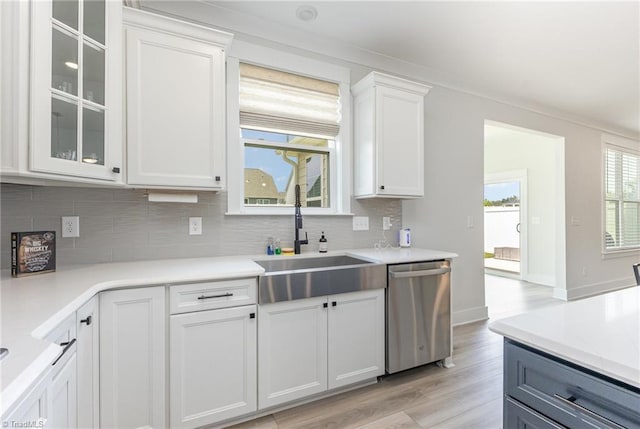 1515 Peabody Ct, Mebane, NC 27302 - kitchen with dishwasher, light wood-style flooring, tasteful backsplash, white cabinetry, and light countertops