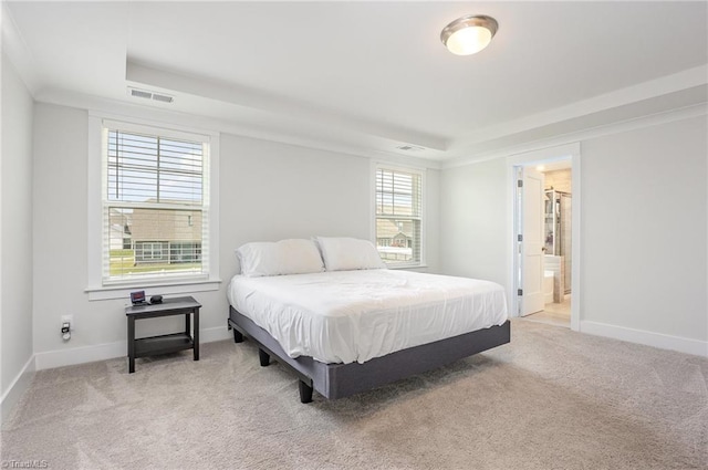 1515 Peabody Ct, Mebane, NC 27302 - bedroom featuring a raised ceiling, carpet floors, and connected bathroom