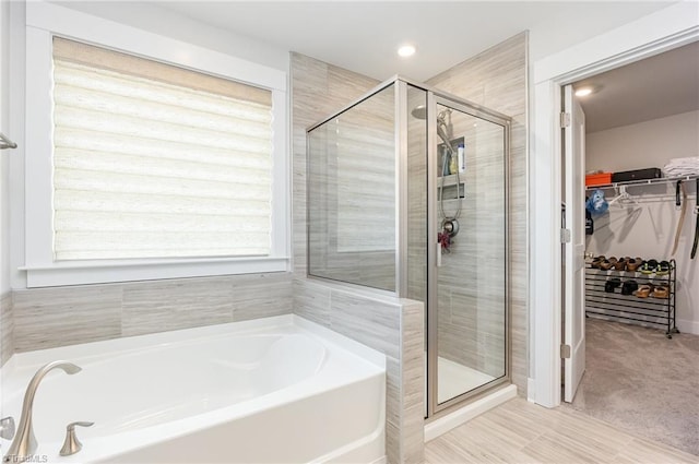 1515 Peabody Ct, Mebane, NC 27302 - bathroom with a garden tub, a stall shower, and a walk in closet