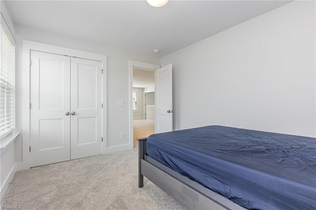 1515 Peabody Ct, Mebane, NC 27302 - bedroom featuring light colored carpet, multiple windows, and a closet