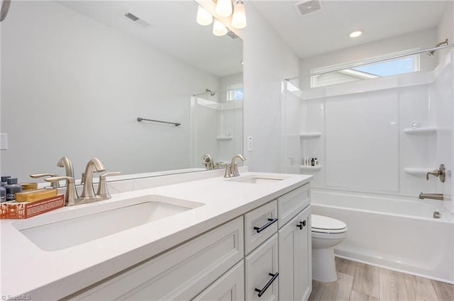 1515 Peabody Ct, Mebane, NC 27302 - full bathroom with double vanity, shower / bath combination, and wood finished floors