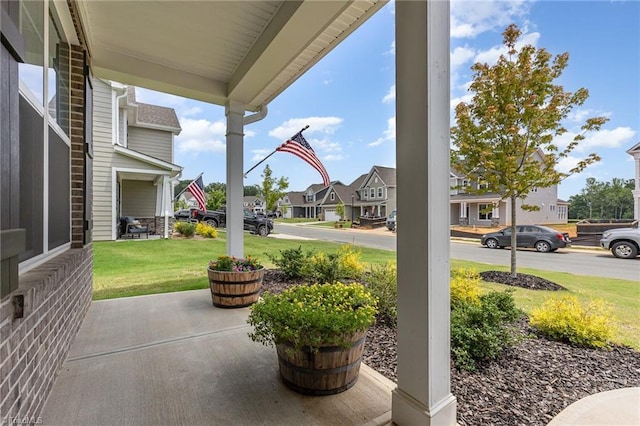 1515 Peabody Ct, Mebane, NC 27302 - porch featuring a residential view and a lawn