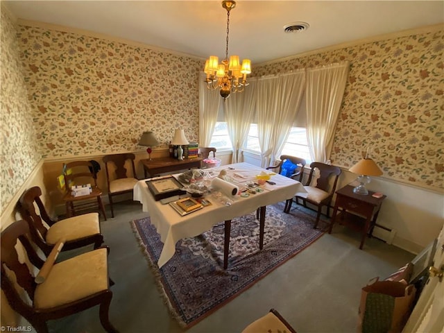 interior space featuring a chandelier and a baseboard heating unit