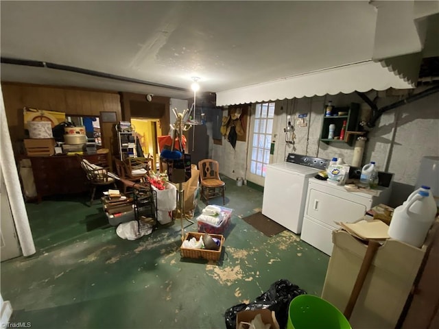 basement with fridge and separate washer and dryer