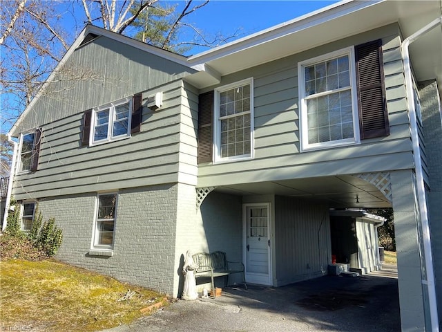 view of property exterior featuring a carport