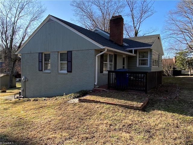 back of property featuring a lawn