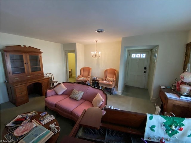 living room with an inviting chandelier and carpet