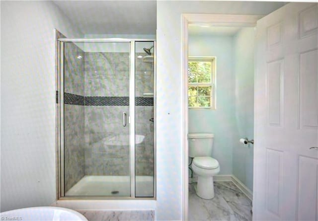 bathroom with toilet and walk in shower