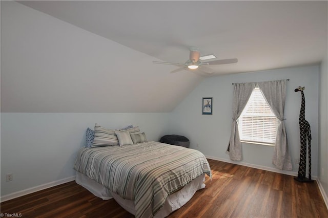 bedroom with dark wood-type flooring, ceiling fan, and vaulted ceiling