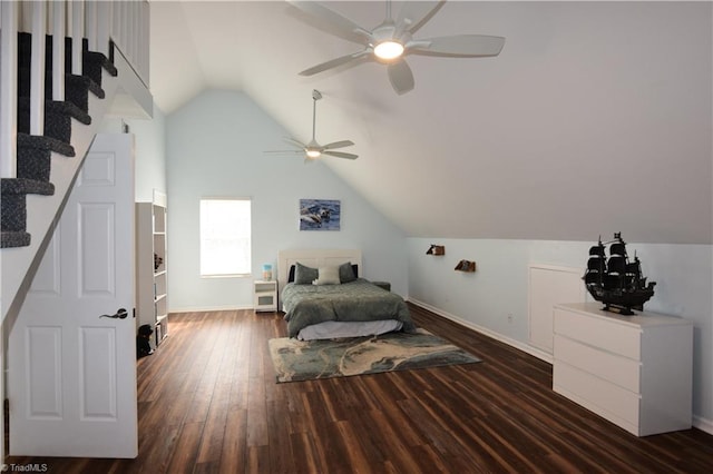 bedroom featuring dark hardwood / wood-style flooring, vaulted ceiling, and ceiling fan