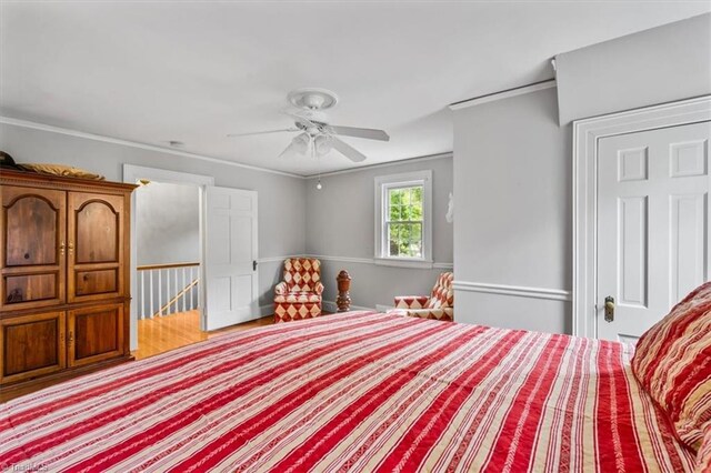 bedroom featuring ornamental molding and ceiling fan
