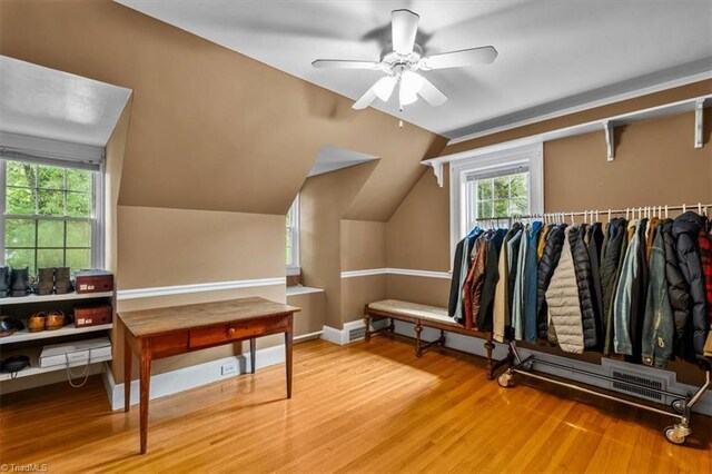 bonus room featuring wood finished floors, ceiling fan, and vaulted ceiling