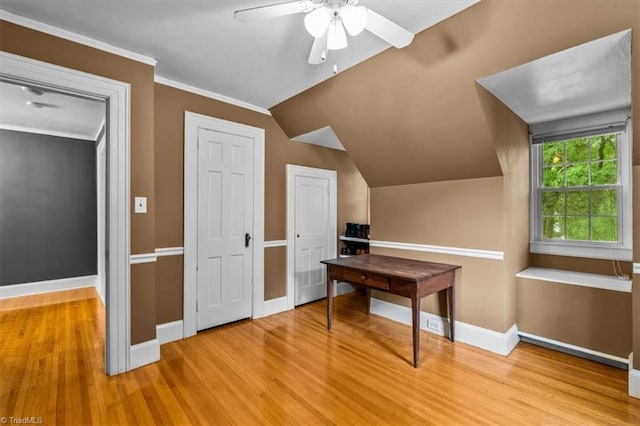 bonus room featuring wood finished floors, a ceiling fan, baseboards, and vaulted ceiling