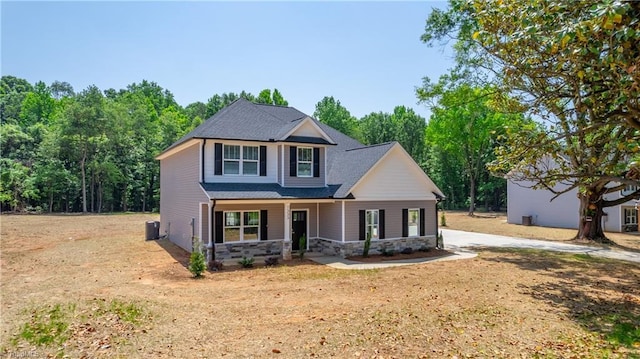 1333 Union Cross Rd, Kernersville, NC 27284 - view of front of property with a porch, stone siding, driveway, cooling unit, and a shingled roof