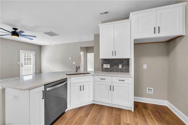 1333 Union Cross Rd, Kernersville, NC 27284 - kitchen with stainless steel dishwasher, a sink, a peninsula, light wood-style flooring, and ceiling fan