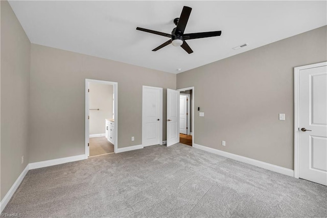 1333 Union Cross Rd, Kernersville, NC 27284 - unfurnished bedroom with carpet flooring, baseboards, ensuite bath, and a ceiling fan