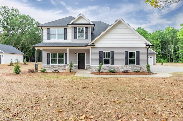 1333 Union Cross Rd, Kernersville, NC 27284 - craftsman-style home featuring stone siding, concrete driveway, a porch, a shingled roof, and an attached garage