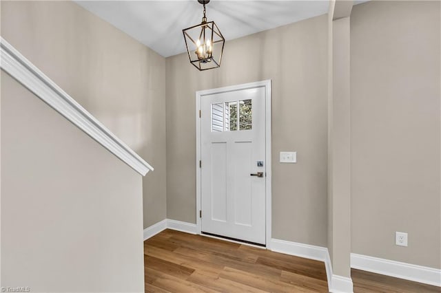 1333 Union Cross Rd, Kernersville, NC 27284 - entryway with a chandelier, wood finished floors, and baseboards
