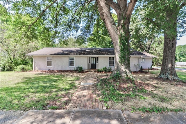 ranch-style house with a front lawn