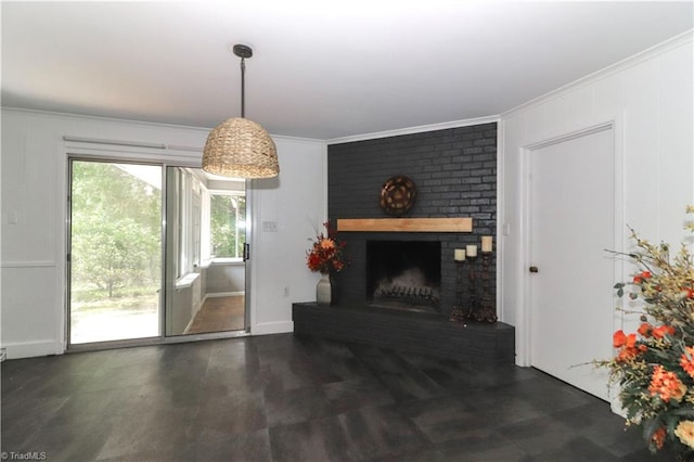 unfurnished living room featuring ornamental molding and a fireplace