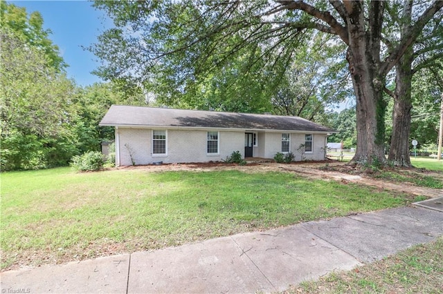 ranch-style house with a front yard