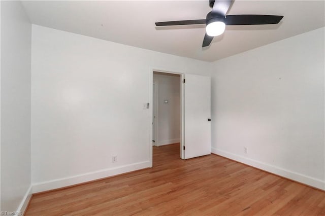 empty room featuring ceiling fan and light hardwood / wood-style floors